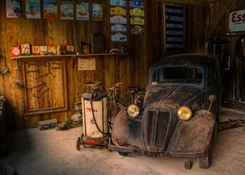 Mechanic inspecting used auto parts with a warranty in a USA auto shop